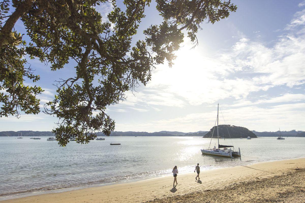 Yacht anchored off a beach at Paihia, Bay of Islands