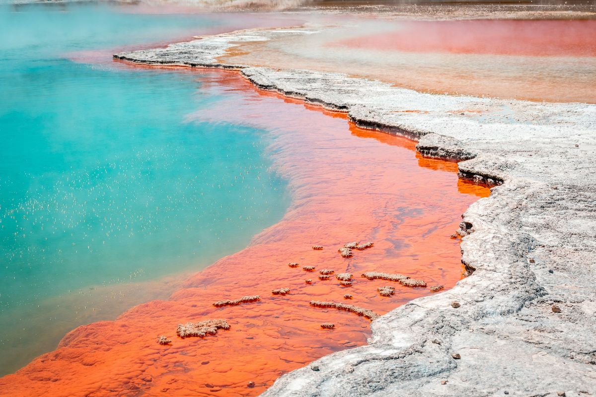 Turquoise geothermal pool with orange mineral edge, Rotorua